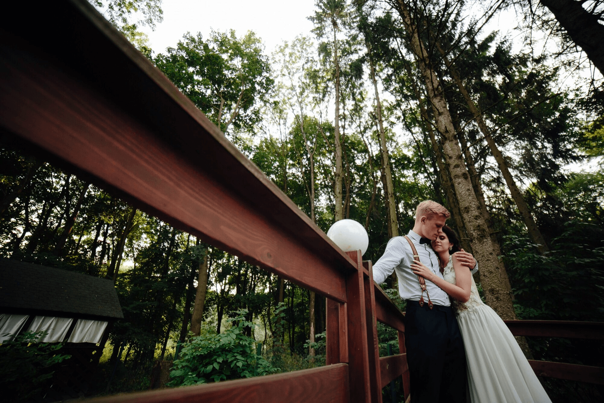 Couple hugging next to the fence